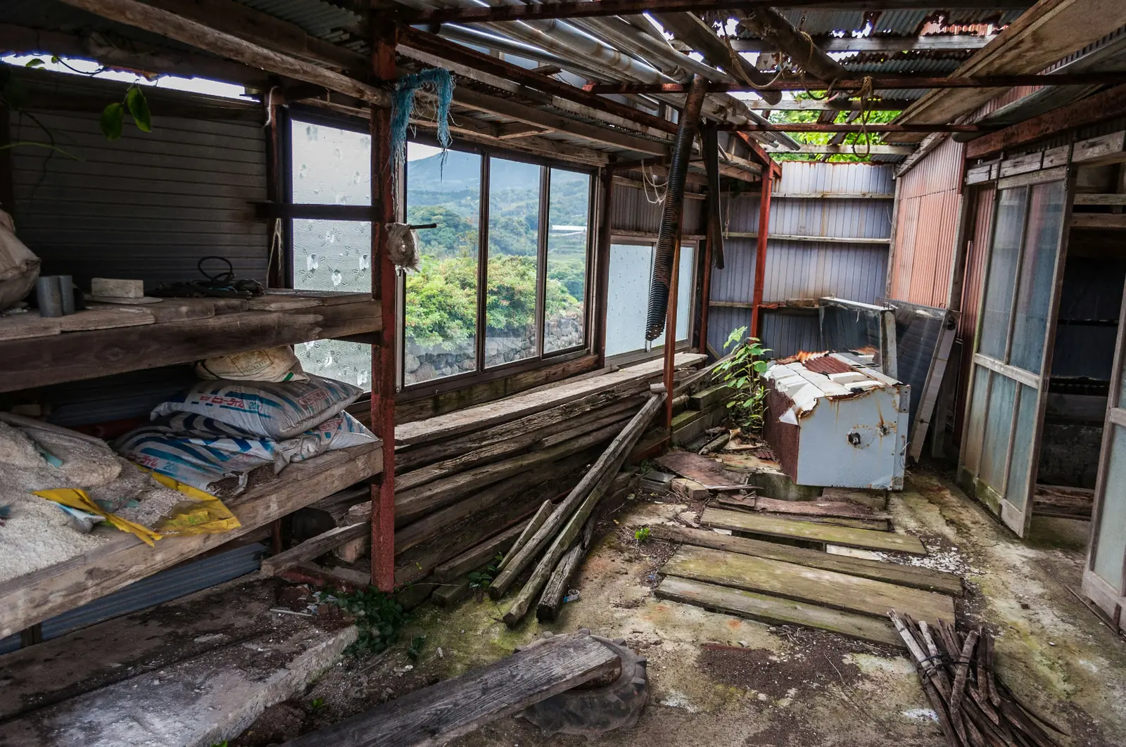 Interior of a long-vacant house in rural Japan with a collapsed ceiling